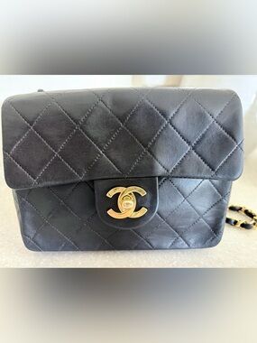 CHANEL Black Quilted Lambskin Mini Flap Bag with Gold Chain